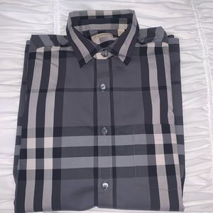 Black and white stripped men’s Burberry shirt.